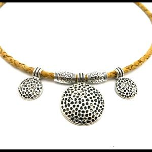 Cork leather with silver medallions.